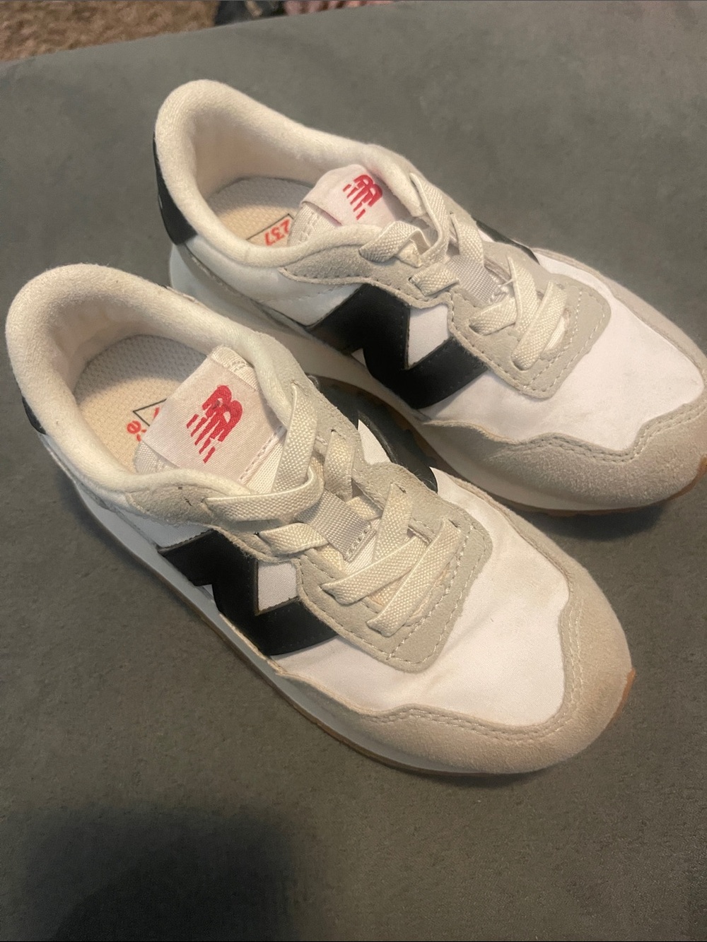 New Balance Kids White Sneakers with Black Side Logo and Red Branding